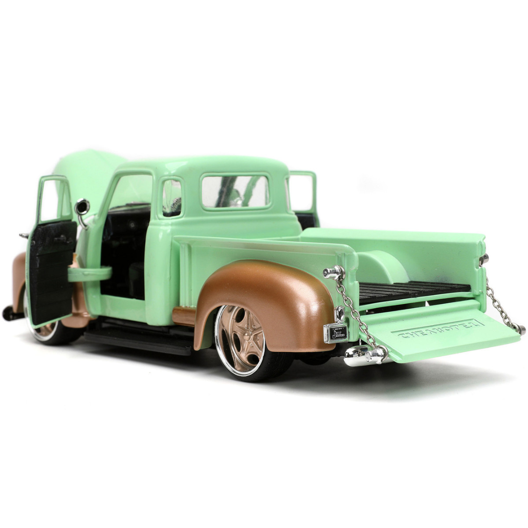 1953-chevrolet-3100-pickup-truck-green-and-gold-rustys-garage-with-extra-wheels-1-24-diecast